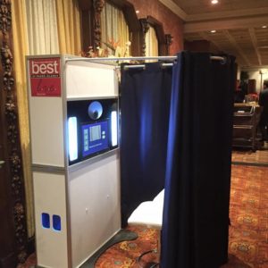 Our Classic Photo Booth package includes our curtain enclosure (different colors available). The curtain rods are removable so you have the option to have it open air with either a backdrop or nothing at all.